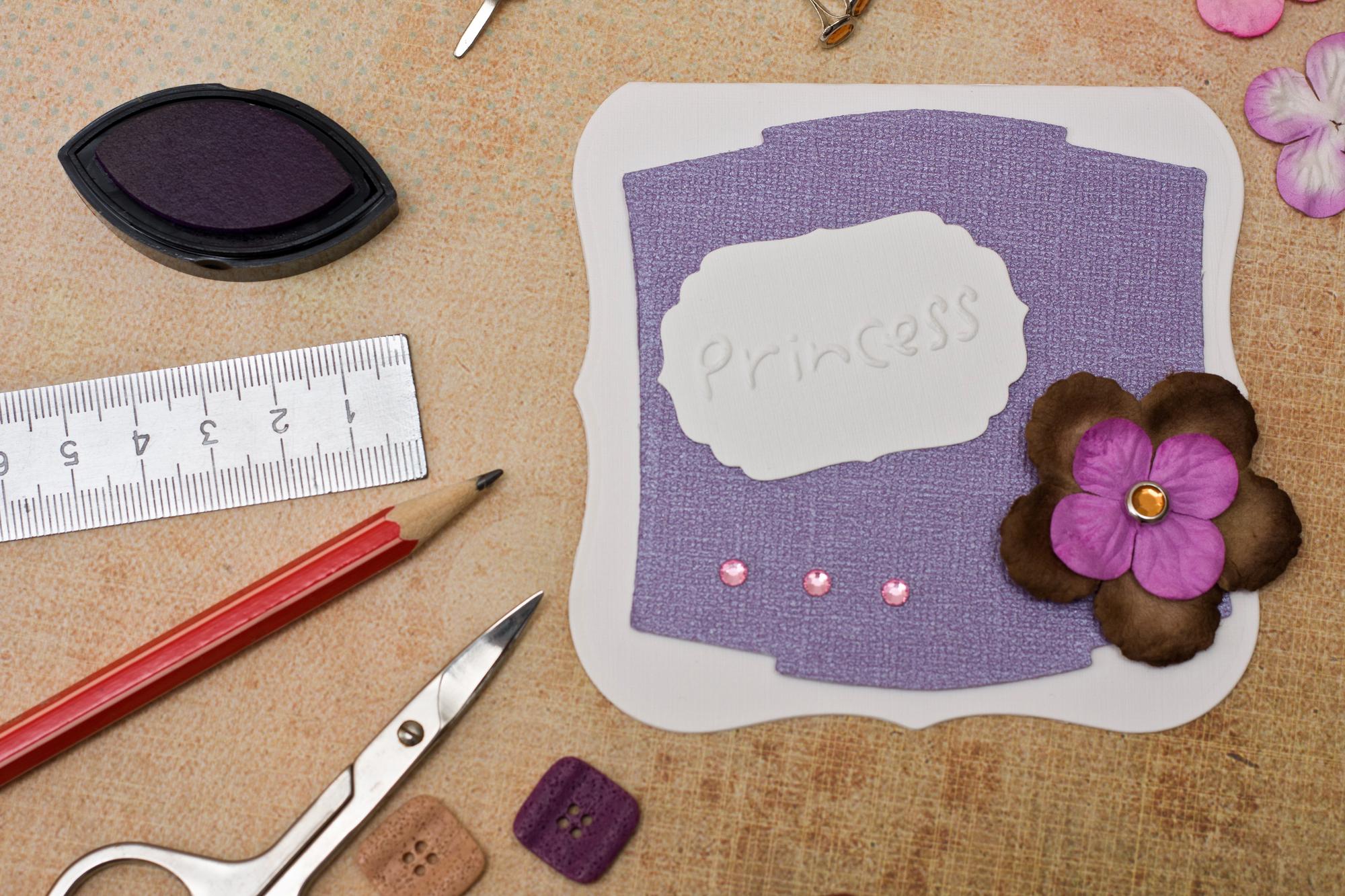 Set of embroidered patches on craft paper